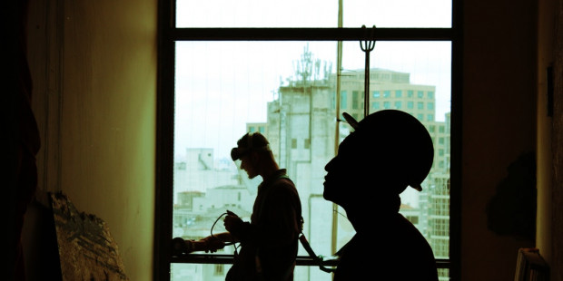 silhouette of construction workers